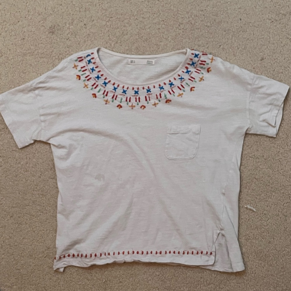 Super cute white shirt with embroidered detailing on collar and sleeves